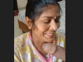 A mature Indian wife performs oral sex on her husband
