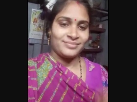 A lovely Indian woman removes her saree in a sensual video