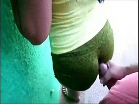 A girl wearing spandex performs an anal sex act