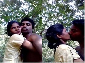 Passionate Indian couple kissing in the great outdoors