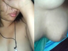 Indian girl hides her face but man reveals her XXX tits in sex tape