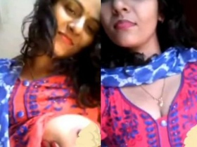 Bhabhi flaunts her big breasts in seductive manner