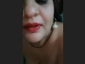 A desi woman showcases her large breasts