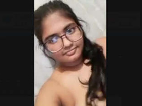 Desi babe with big tits flaunts her curves in the office