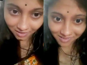 A lovely South Asian girlfriend reveals her large breasts during a video chat