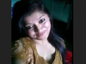 A beautiful girl teases her lover in this video