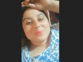 Indian housewife proudly displays her large breasts on camera