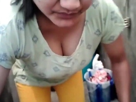 Handsy aunty fondling her ample bosom while doing laundry