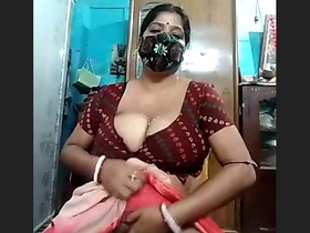 A mature woman with large breasts enjoys some erotic activities