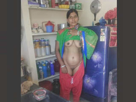 Rashma, the attractive older woman, undresses