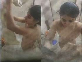 Beautiful girl enjoys bathing in front of camera
