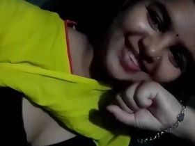 An enticing Indian beauty reveals her breasts and moist pussy while pleasuring herself