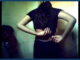 An Indian coed with a tan engages in risqué behavior on film
