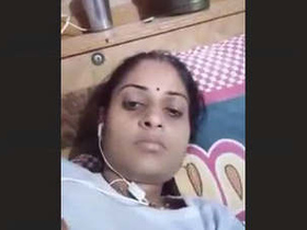 Horny Bhabi fondles her breasts during a video call