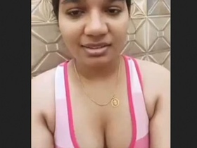 Indian aunty displays her breasts