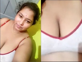 A big-breasted neighbor reveals her naked vagina