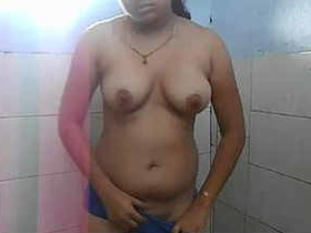 Indian girl displays herself while pleasuring herself in the restroom