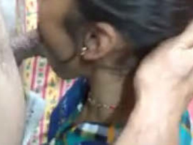 Indian wife gives a sloppy blowjob to her husband