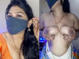 Indian woman with big breasts performs a sensual erotic show