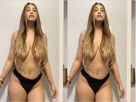 Watch a stunning Indian babe flaunt her massive breasts