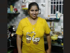 Telugu auntie with large breasts takes a bath