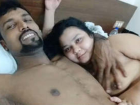 An Indian couple's playful time in a hotel room