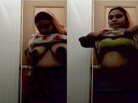 Desi housewife flaunts her large breasts and pussy in part 2
