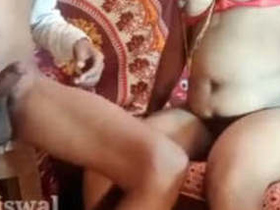 Fat ass babe in a maxi skirt perches on a stepladder