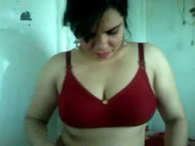 Radha Bhabhi's sexy talk and red lingerie in a steamy video