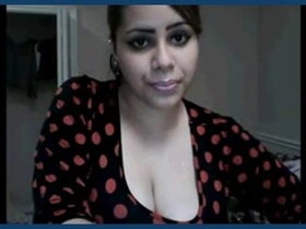 An attractive Indian college student proudly displays her large breasts