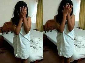 Shy Indian girl hides her face in embarrassment