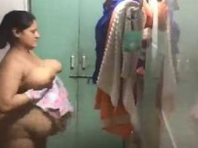 Big-busted aunty caught in the act on secret camera