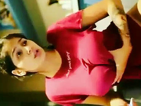 A busty Indian beauty fondling her ample breasts