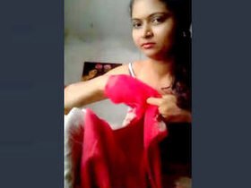 A stunning Indian babe flaunts her breasts and pussy in a sensual video