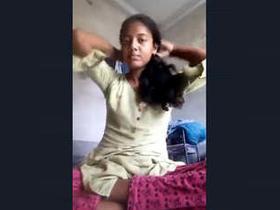 Indian girl displays her breasts in a seductive manner