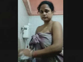 Desi wife with large breasts records intimate video with husband during bath