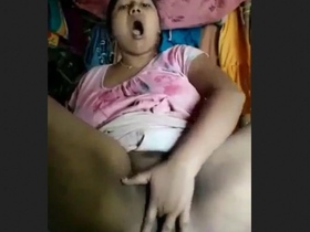 Aroused South Asian woman stimulating herself with her fingers