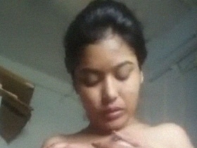 Indian woman with big breasts enjoys nude selfie session