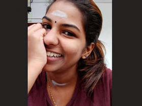 A stunning mallu babe flaunts her breasts and pussy in a steamy video
