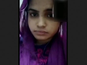 A stunning and adorable girl displays herself