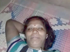 Middle-aged aunty indulges in steamy nighttime sex