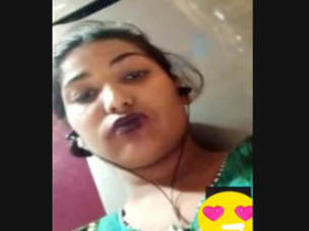 Aroused Indian woman pleasures herself by licking and fingering her vagina during a video call