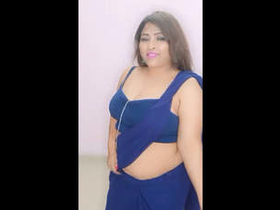 Attractive woman with large breasts performs sensual dance routine