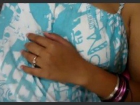 Indian bhabhi sleeps with her arm under the blanket