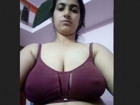Attractive Southern Indian woman undresses for self-portrait