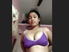 Asian teen girl flaunts her assets