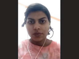 Watch a cute Indian girl show off her boobs in this video
