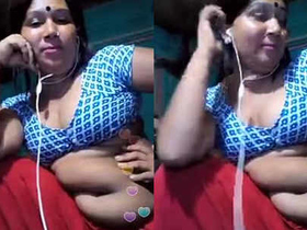 Aunt with a large belly talks on webcam