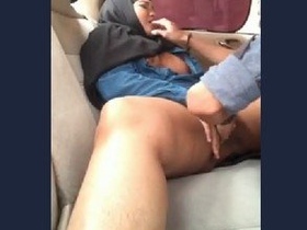 Excited hijabi up for anything in car