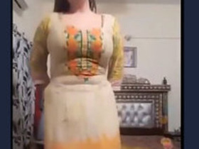 Watch a stunning Pakistani girl dance seductively in a steamy video
